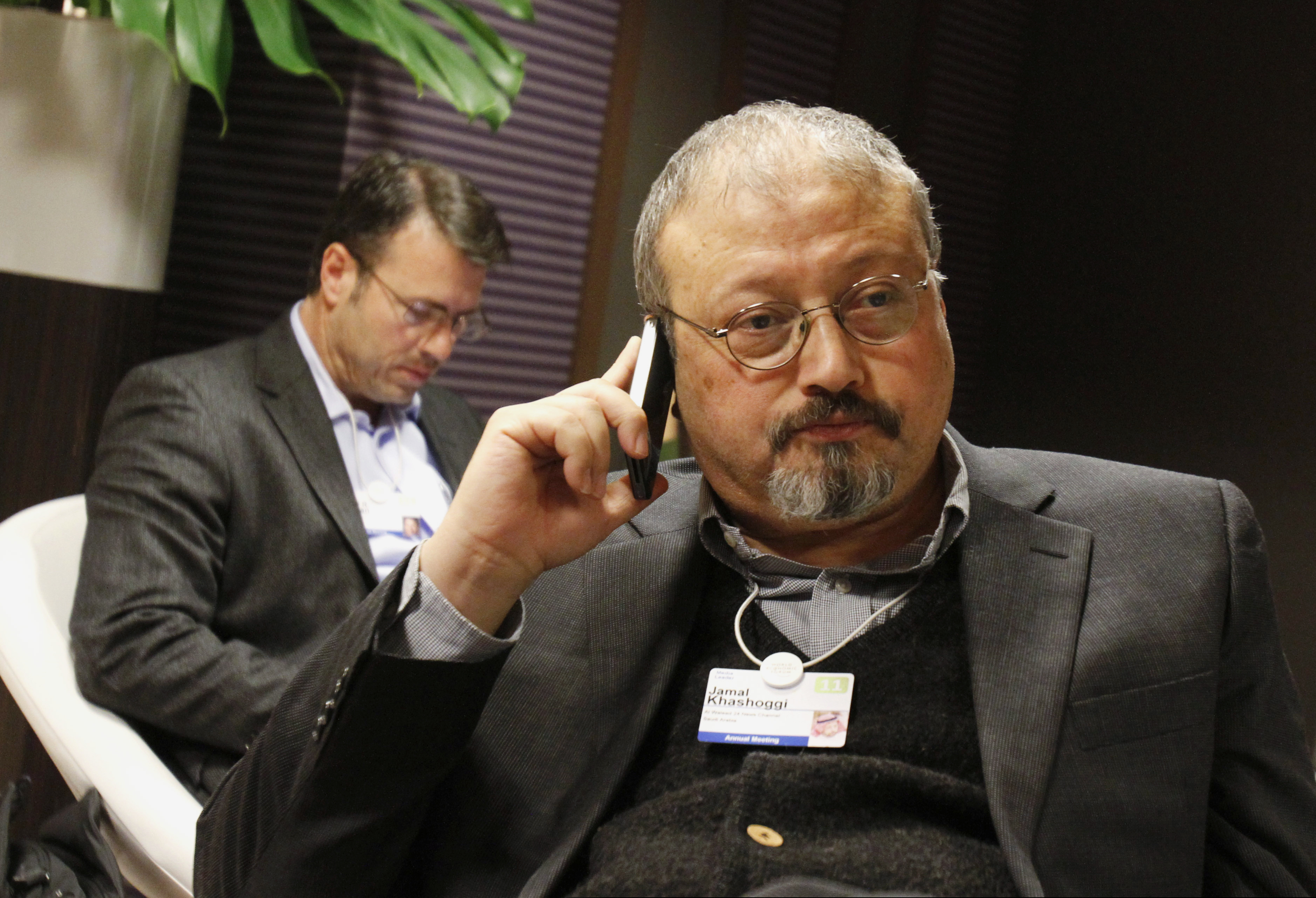 (Virginia Mayo | The Associated Press) In this Jan. 29, 2011 file photo, Saudi journalist Jamal Khashoggi speaks on his cellphone at the World Economic Forum in Davos, Switzerland. Saud Al-Mojeb, Saudi Arabia’s top prosecutor, is recommending the death penalty for five suspects charged with ordering and carrying out the killing of Saudi writer Jamal Khashoggi. Al-Mojeb told a press conference in Riyadh Thursday, Nov. 15, 2018, that Khashoggi’s killers had been planning the operation since September 29, three days before he was killed inside the kingdom’s consulate in Istanbul.