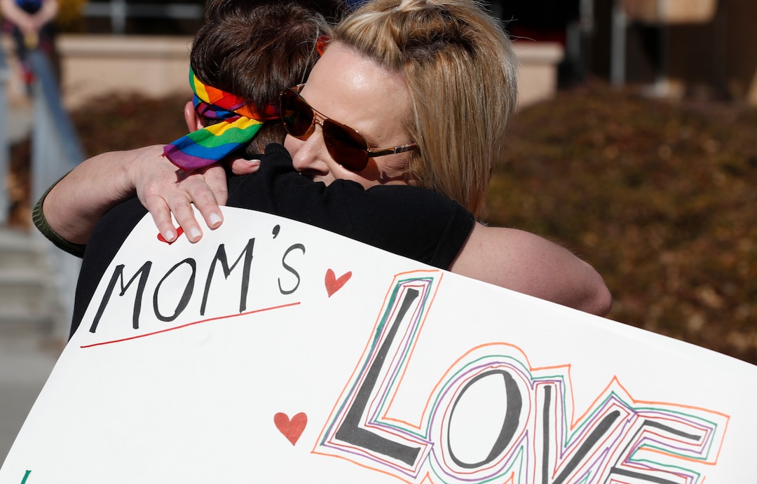 (George Frey  |  special to The Salt Lake Tribune) Kyle Brodrick (L) a sophomore at BYU is hugged by his mother Joni (R) who flew in from Virginia as a surprise to support her son and other BYU students in protest of BYUÕs rollback of a newly announced policy change on LGBTQ students at a  in the campus of Brigham Young University on March 5, 2020 in Provo, Utah.
