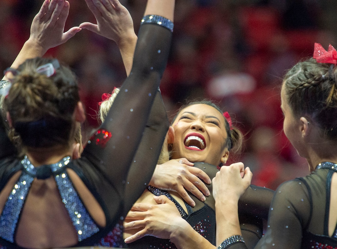 (Rick Egan  |  The Salt Lake Tribune)  The Utes congratulate Kari Lee after her performance on the balance beam, in PAC-12 gymnastics action between the UCLA Bruins and the University of Utah, at the Jon M. Huntsman Center, Saturday, Feb. 23, 2019.