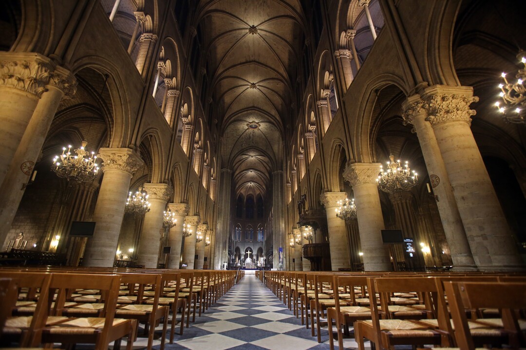 View of Notre Dame Cathedral in Paris with its new interior lighting presented Tuesday March 11, 2014. The new lighting design at the Notre-Dame cathedral is made of lead fixtures to highlight the XIIth century monument. Around 14 million people visit the Cathedral each year. (AP Photo / Remy de la Mauviniere)  