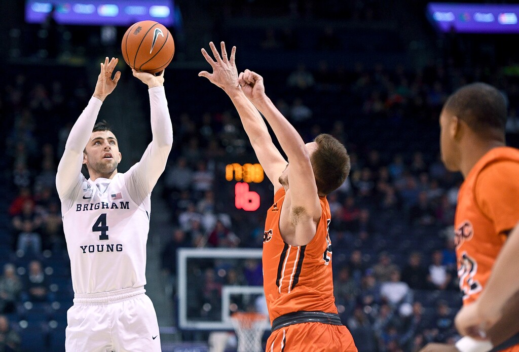 BYU guard Nick Emery (4) shoots over Pacific guard Max Tinsley (14) during an NCAA college basketball game, Saturday, Jan. 7, 2017 in Provo, Utah. (Isaac Hale/The Daily Herald via AP)
