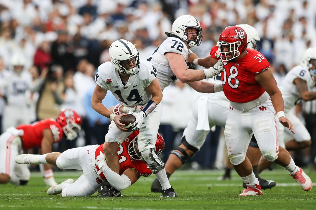 (Meg Oliphant | Special to The Tribune) Utah linebacker Karene Reid (21) sacks Sean Clifford (14) of the Penn State Nittany Lions in the second quarter at Rose Bowl Stadium on Jan. 2, 2023 in Pasadena, Calif.
