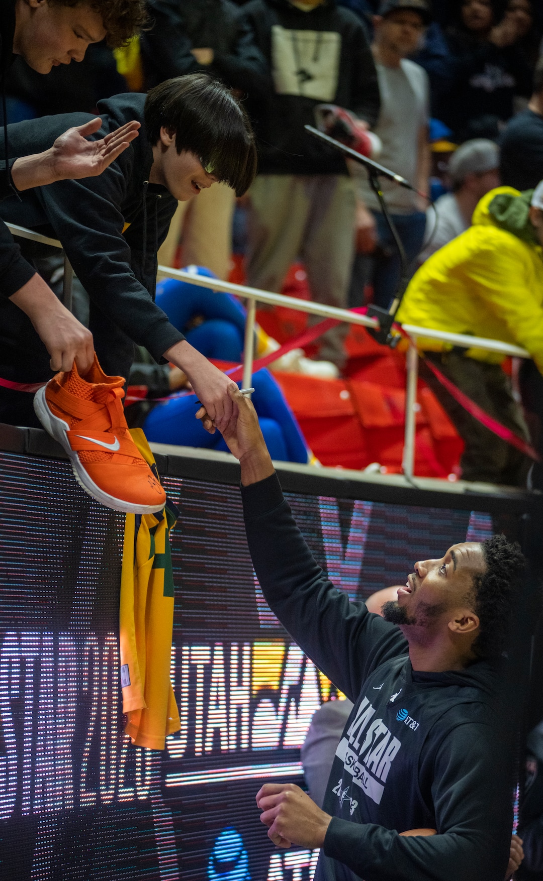 (Rick Egan | The Salt Lake Tribune) Donovan Mitchell signs autographs during the All-Star Practice at the Jon M. Huntsman Center, on Saturday, Feb. 18, 2023.