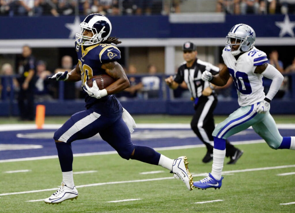 Michael Ainsworth | The Associated Press. Los Angeles Rams running back Todd Gurley (30) sprints to the end zone past Dallas Cowboys cornerback Anthony Brown, right, for a touchdown in the second half of an NFL football game, Sunday, Oct. 1, 2017, in Arlington, Texas.