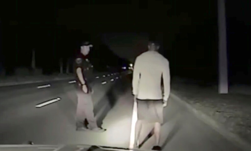 In this Monday, May 29, 2017 still image taken from video provided by the Jupiter Police Department Tiger Woods steps off line during a field sobriety test after he was found sound asleep behind the wheel of his car partially on the road in Jupiter, Fla. Woods was arrested on suspicion of driving under the influence. Woods issued a statement nearly 10 hours after he was released from jail on Monday that alcohol was not involved. (Jupiter Police Department via AP)