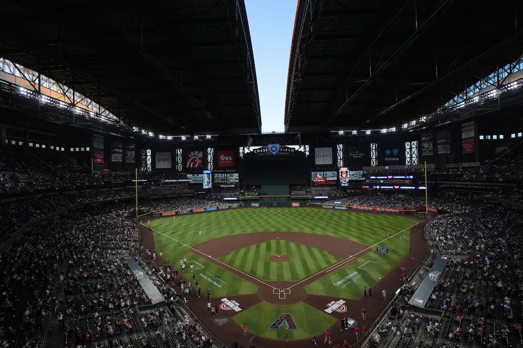 (Ross D. Franklin | AP) The roof to Chase Field begins to open prior to an opening-day baseball game between the Arizona Diamondbacks and the Chicago Cubs Thursday, March 27, 2025, in Phoenix.