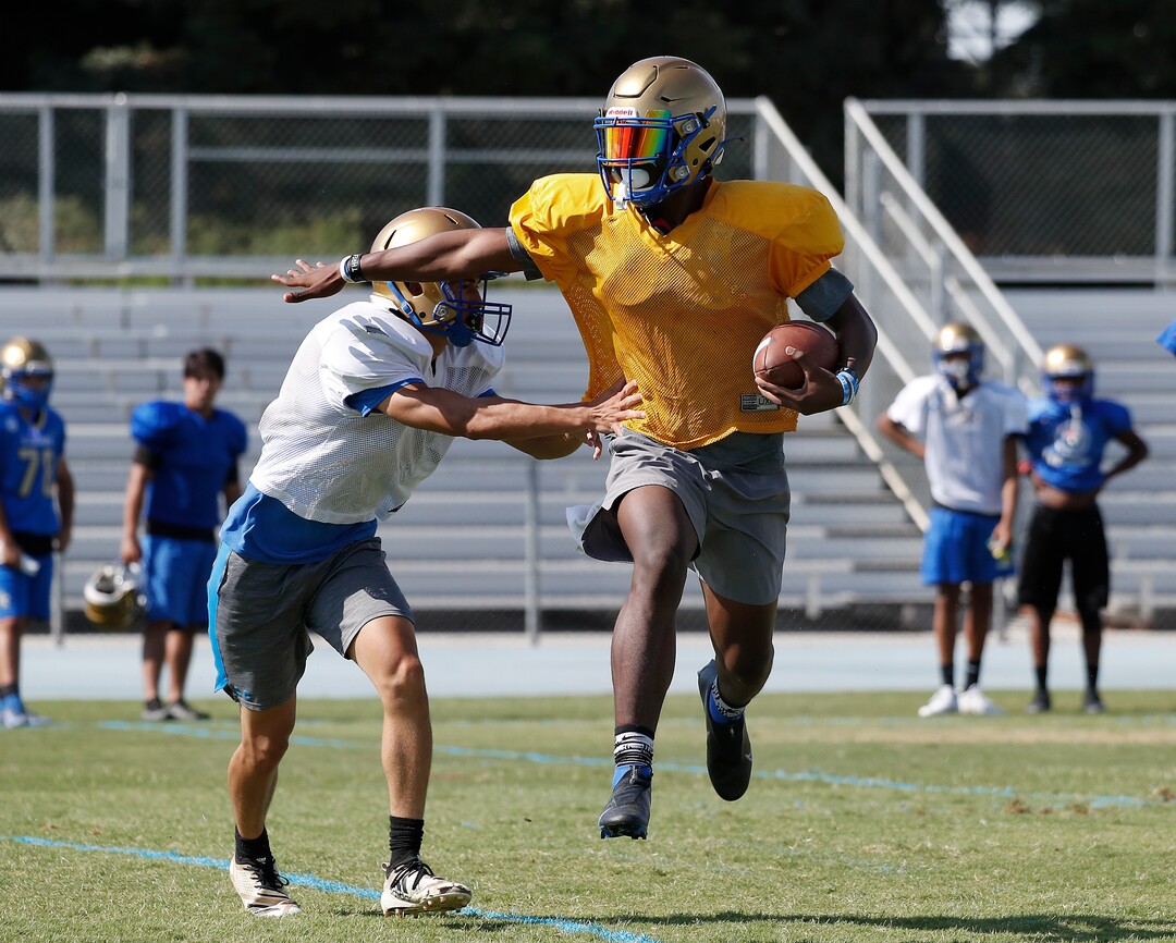(Gary Kazanjian | Special to The Tribune) Clovis High School quarterback Nate Johnson works out with his team at Clovis High School, who committed to play for the University of Utah, shown Wednesday, July 28, 2021, in Clovis, Calif.
