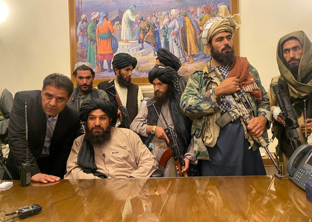 (Zabi Karimi | The Associated Press) Taliban fighters take control of Afghan presidential palace after the Afghan President Ashraf Ghani fled the country, in Kabul, Afghanistan, Sunday, Aug. 15, 2021.