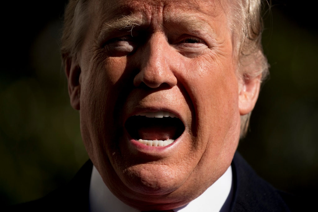 President Donald Trump speaks to members of the media before boarding Marine One on the South Lawn of the White House in Washington, Sunday, Nov. 4, 2018, for a short trip to Andrews Air Force Base, Md., and then on to Macon, Ga., and Chattanooga, Tenn. for rallies. (AP Photo/Andrew Harnik)