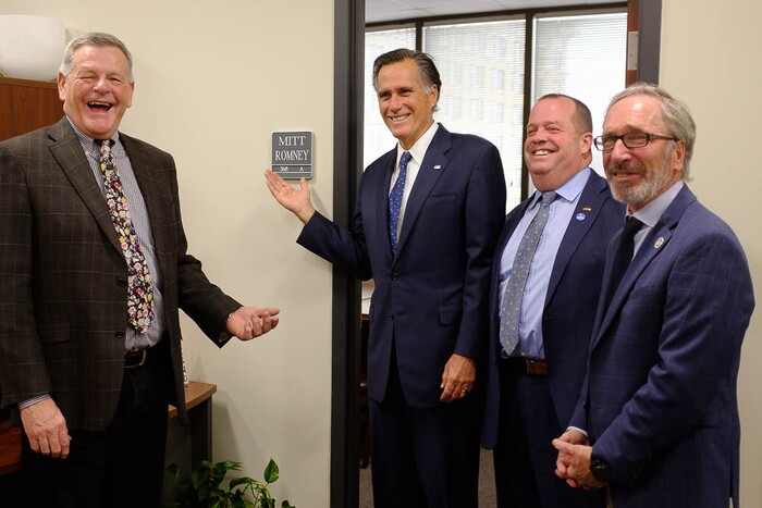 (Trent Nelson | The Salt Lake Tribune)
Senator Mitt Romney poses in front of a conference room bearing his name after meeting with Weber County Comissioners in Ogden to discuss the ongoing government shutdown on Friday Jan. 18, 2019. From left, Commissioner Scott Jenkins, Romney, Commissioner James Harvey, and Commissioner Gage Froerer.