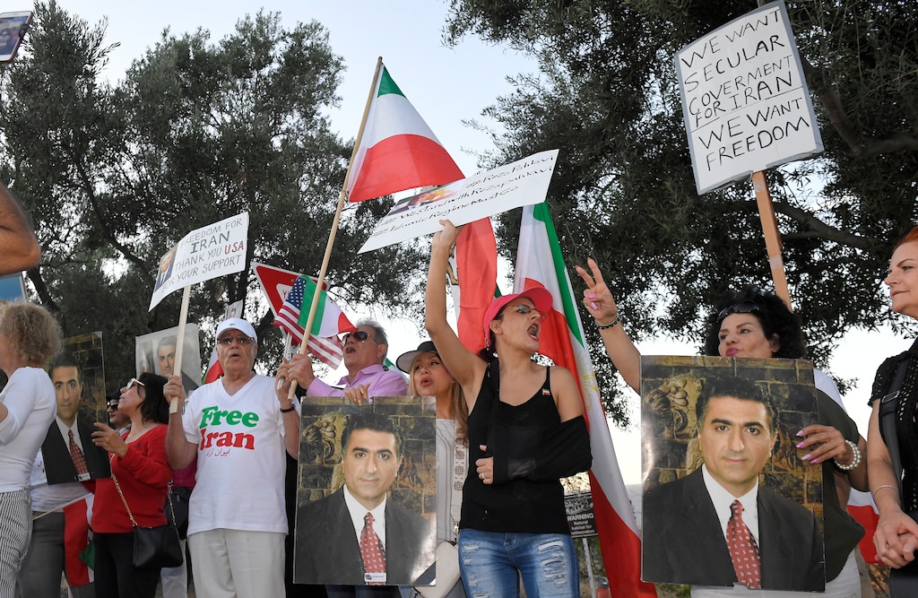 (Mark J. Terrill | The Associated Press) Protesters against the current Iranian regime stand outside the Ronald Reagan Presidential Library and Museum in Simi Valley, Calif., where U. S. Secretary of State Mike Pompeo was speaking Sunday, July 22, 2018.