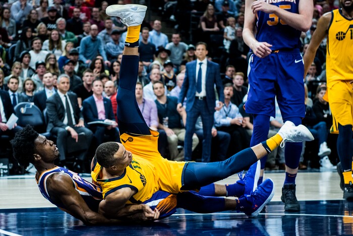 (Chris Detrick  |  The Salt Lake Tribune)  Utah Jazz guard Dante Exum (11) fouls Phoenix Suns guard Josh Jackson (20) during the game at Vivint Smart Home Arena Thursday, March 15, 2018. Utah Jazz defeated Phoenix Suns 116-88.