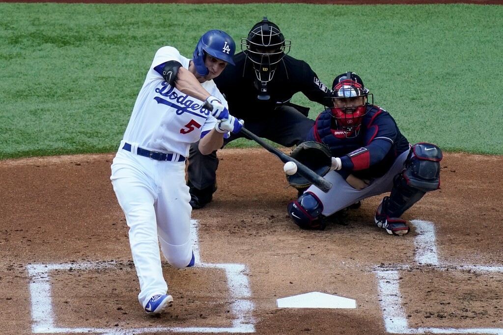 Los Angeles Dodgers' Corey Seager watches his home run against the Atlanta Braves during the first inning in Game 6 of a baseball National League Championship Series Saturday, Oct. 17, 2020, in Arlington, Texas. (AP Photo/Sue Ogrocki)