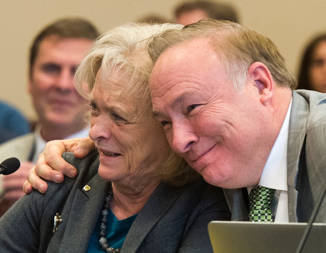 (Rick Egan  |  The Salt Lake Tribune)   Sen. Jim Dabakis gives Gayle Ruzicka, Utah Eagle Forum, a hug, as she speaks in support of his bill, SJR16 during a Senate Education Committee meeting at the Capitol, Friday, March 2, 2018.