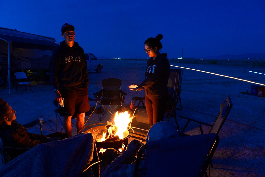 (Scott Sommerdorf | The Salt Lake Tribune)Volunteers at Aid Station 14 warm themselves around a fire at the Salt Flats 100 Endurance Run, Saturday, May 5, 2018.