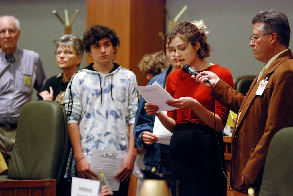 (AP Photo/Morgan Lee) In this Monday, Feb. 4, 2019, photo, high school student Sophia Lussiez, 17, of Santa Fe, N.M., second from right, testifies in support of proposals for new gun safety regulations in the state, in Santa Fe, N.M. The New Mexico Legislature is considering a bill that would temporarily restrict firearms access for people considered to be at risk to themselves or others. Various states are considering similar regulations since last year's mass shooting at a Florida high school.