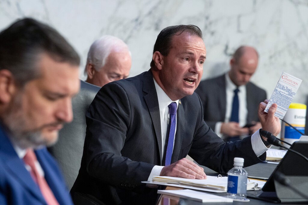 (Tom Williams | Pool) Sen. Mike Lee, R-Utah, holds a copy of the Constitution while questioning witnesses during a Senate Judiciary Committee hearing to examine Texas's abortion law, Wednesday, Sept. 29, 2021 on Capitol Hill in Washington.