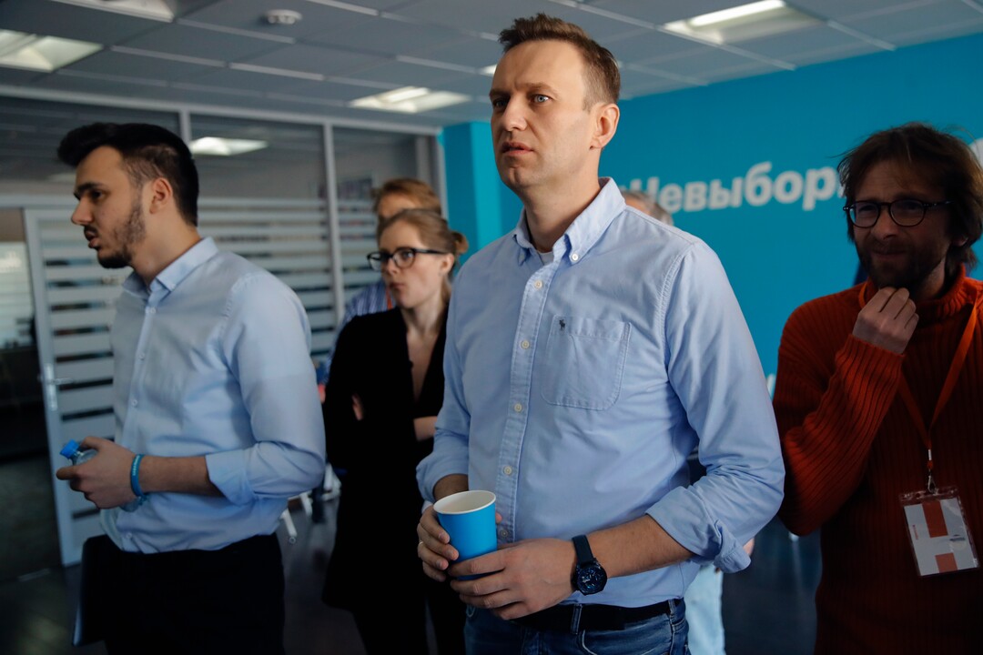 Russian opposition leader Alexei Navalny observes the election progress at his Foundation for Fighting Corruption office, in Russia, Sunday, March 18, 2018. Russians are voting in a presidential election in which Vladimir Putin is seeking a fourth term in the Kremlin. (AP Photo/Pavel Golovkin)