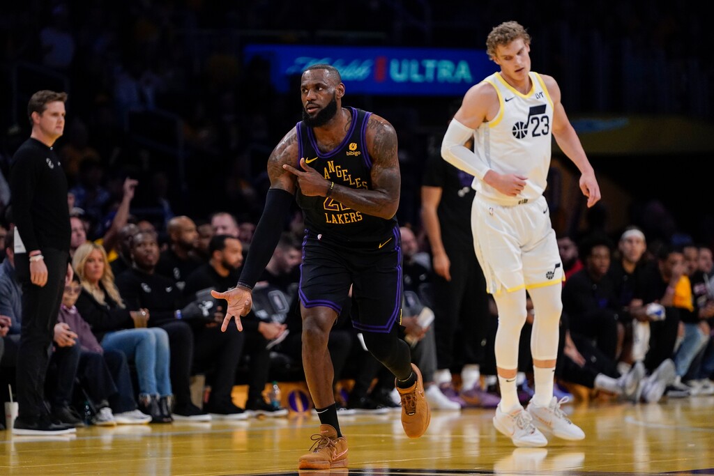 (Ryan Sun) Los Angeles Lakers forward LeBron James, center, reacts after making a 3-point basket during the first half of the team's NBA basketball In-Season Tournament game against the Utah Jazz, Tuesday, Nov. 21, 2023, in Los Angeles.