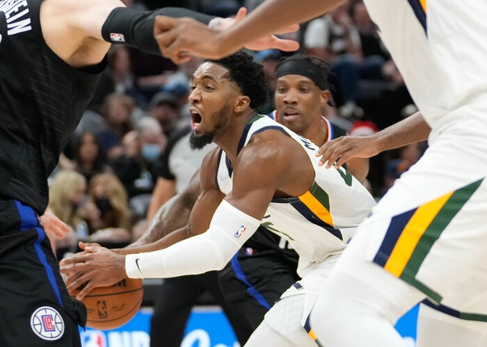 (Francisco Kjolseth | The Salt Lake Tribune) Utah Jazz guard Donovan Mitchell (45) gets cornered by the defense in NBA action between the Utah Jazz and the LA Clippers at Vivint Smart Home Arena in Salt Lake City, Wednesday, Dec. 15, 2021.