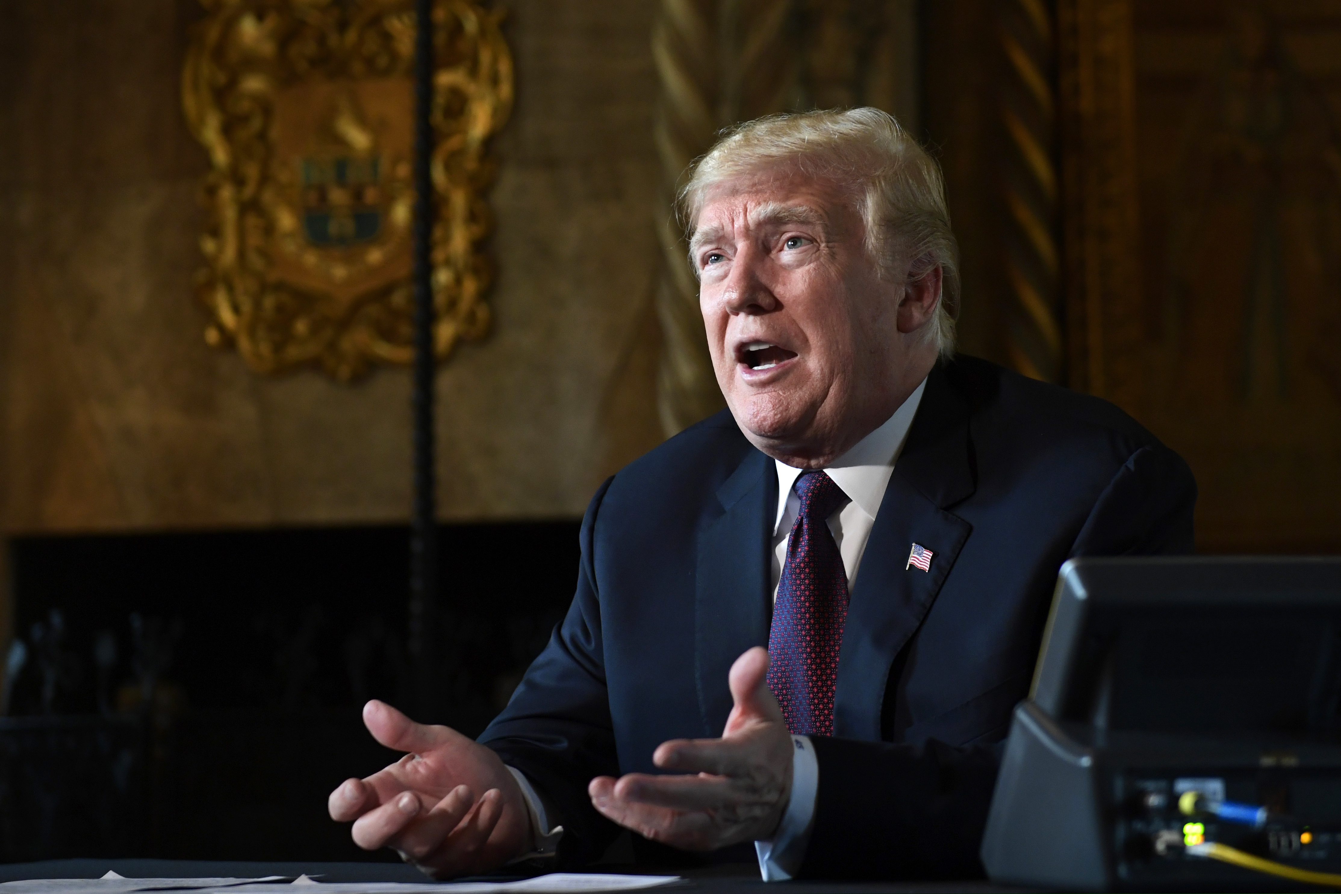 In this Nov. 22, 2018, photo, President Donald Trump speaks with reporters at his Mar-a-Lago estate in Palm Beach, Fla. (AP Photo/Susan Walsh)