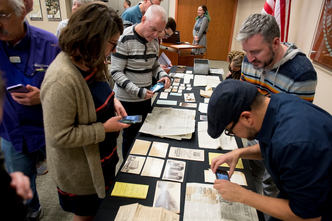 (Jeremy Harmon  |  The Salt Lake Tribune) People view items from a time capsule that was buried in the corner stone of Ogden Academy on September 27, 1887. Items from the time capsule were displayed at the Utah State Archives on Wednesday, Oct. 16, 2019.