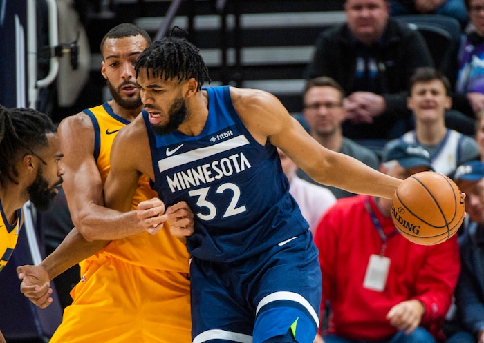 (Rick Egan  |  The Salt Lake Tribune)     Utah Jazz center Rudy Gobert (27) tries to keep Minnesota Timberwolves center Karl-Anthony Towns (32) from getting past him, in NBA action between the Utah Jazz and the Minnesota Timberwolves in Salt Lake City, Monday, Nov. 18, 2019.