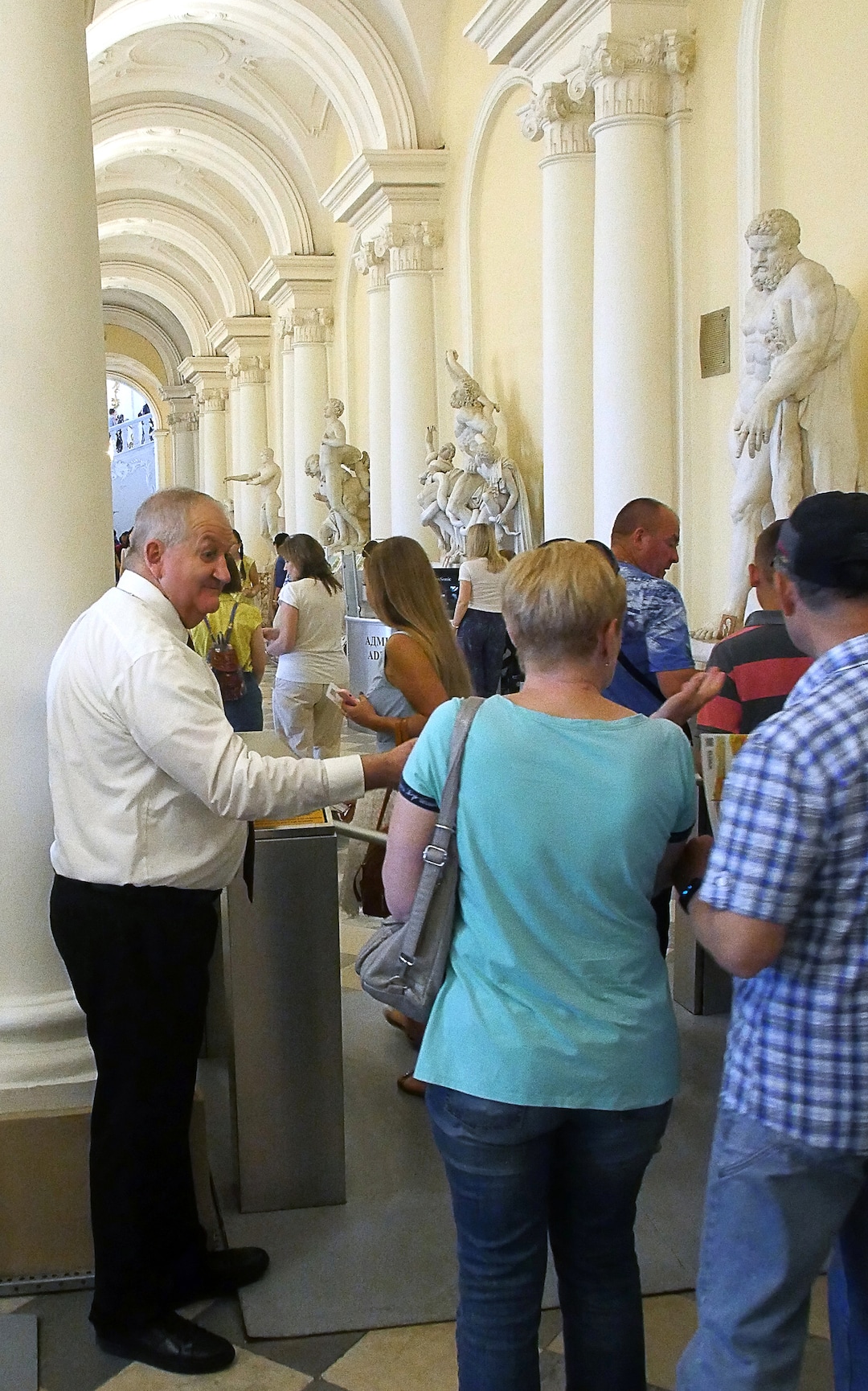 (Michael Stack  | Special to The Salt Lake Tribune) LDS Church “volunteer” Max Wood from Delta, Utah, helps guests at the famed State Hermitage Museum in St. Petersburg.