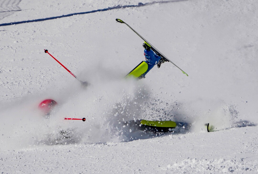 (Francisco Kjolseth | The Salt Lake Tribune) Joachim Mjelde of Westminster College takes a tumble during his first run as he races in men’s slalom as part of the NCAA Skiing Championships on Friday, March 11, 2022, at Park City, Utah.
