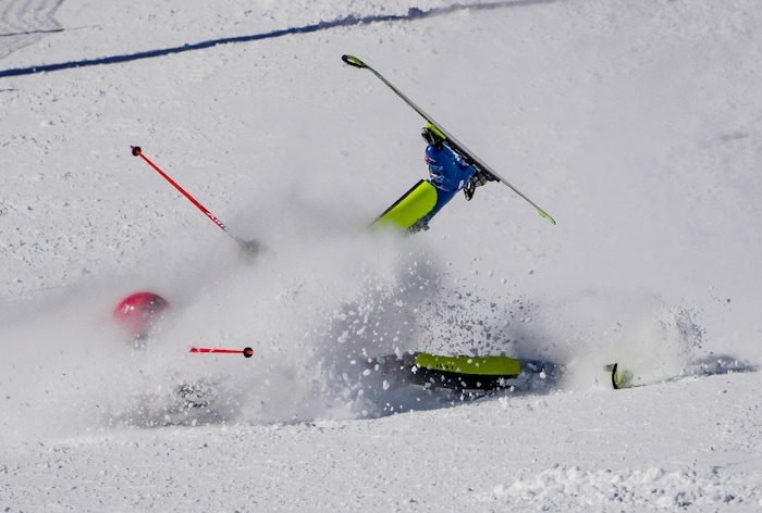 (Francisco Kjolseth | The Salt Lake Tribune) Joachim Mjelde of Westminster College takes a tumble during his first run as he races in men’s slalom as part of the NCAA Skiing Championships on Friday, March 11, 2022, at Park City, Utah.
