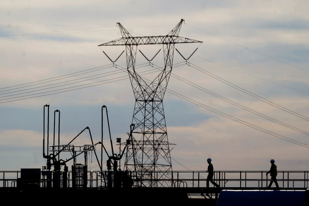 (Rick Bowmer | AP) Transmission towers at a power plant on Wednesday, June 22, 2022, in Delta. The power lines are expected to transport power generated with hydrogen to consumers in California and elsewhere.