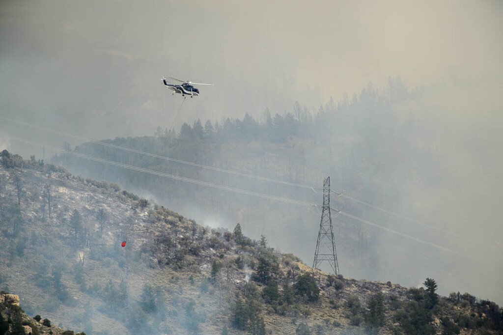 (Trent Nelson | The Salt Lake Tribune)  Helicopters and tankers fight the Dollar Ridge Fire at Strawberry Reservoir, Friday July 6, 2018.