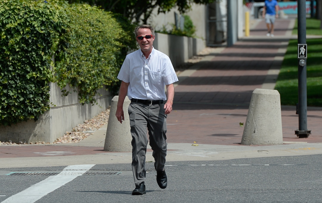 (Francisco Kjolseth  |  The Salt Lake Tribune)  Salt Lake Tribune editor Dave Noyce finishes his race against colleagues after using his own two feet in a transportation race from Library Square to the Tribune building at the Gateway on Thursday, Aug. 2, 2018. Modes of transportation included, rentable electric scooters, Green Bike, TRAX, Lyft, and walking.