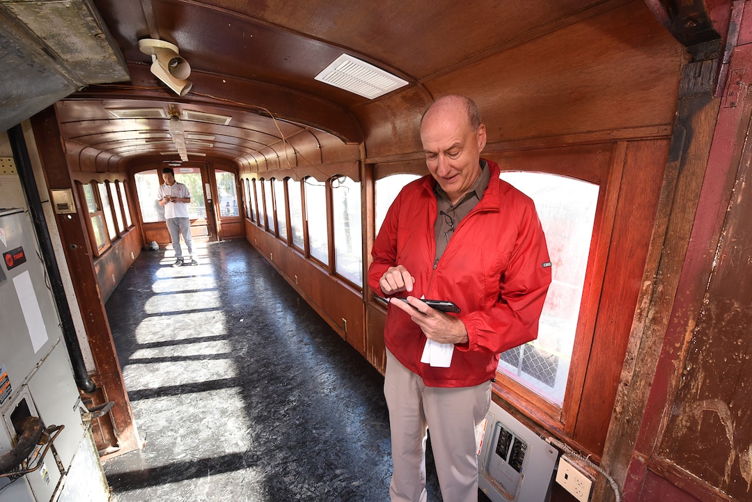(Francisco Kjolseth  |  The Salt Lake Tribune)  Kirk Walton of Salt Lake City overlooks his photos of the last Utah trolley car as he recalls how his great grandfather Robert Lamont Sr. used to be a conductor of the trolley's. The iconic trolley car, that has been sitting in storage for several years, was moved back into view at Trolley Square on Monday, Oct. 15, 2018.