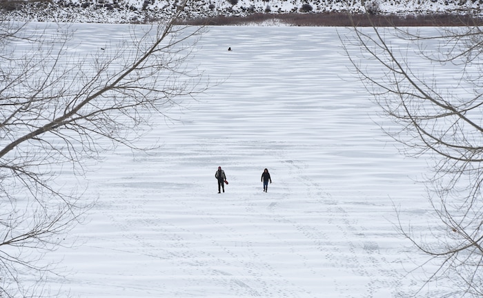 (Francisco Kjolseth | The Salt Lake Tribune) Ice fisherman walk the ice at Echo Reservoir in Summit County next to Coalville which could become a state park.