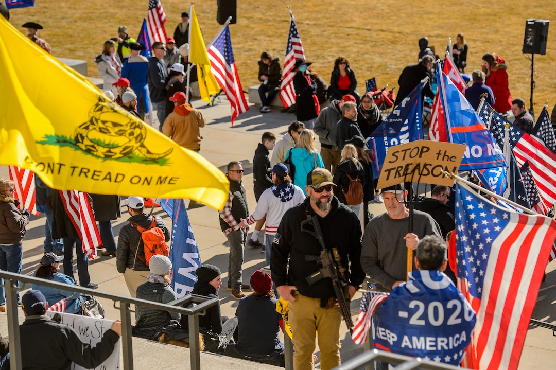 (Trent Nelson  |  The Salt Lake Tribune) A group of Trump supporters listens to speeches at the State Capitol in Salt Lake City on Wednesday, Jan. 6, 2021.