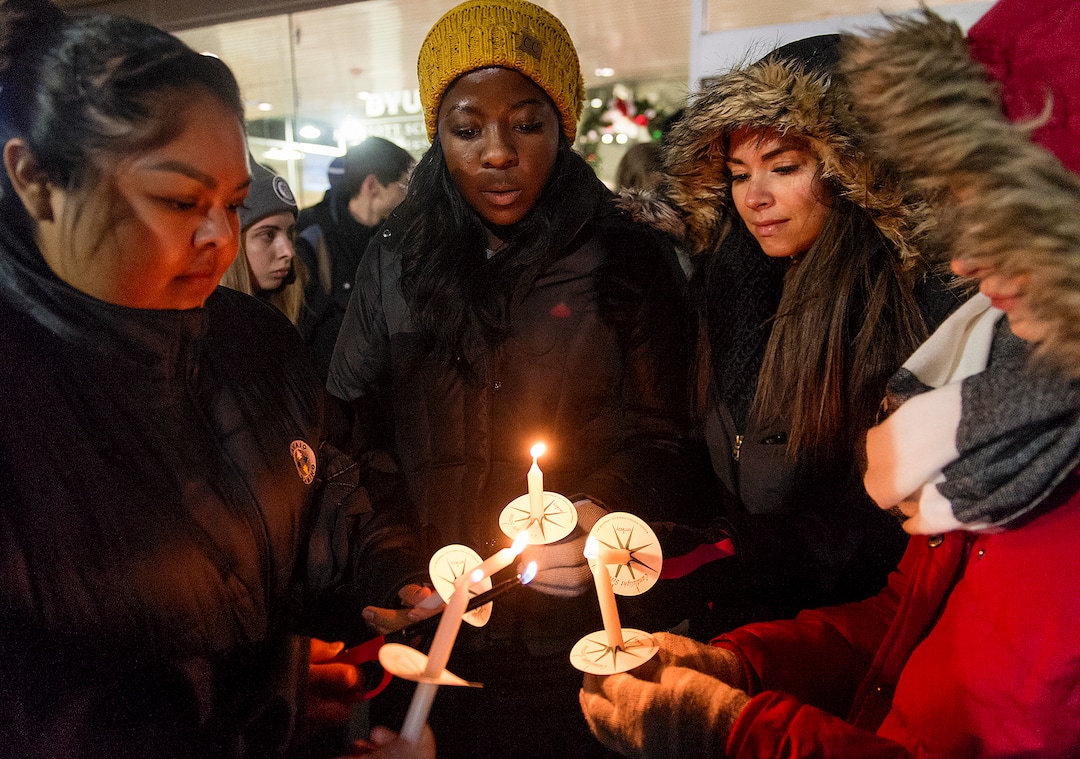 Michael Mangum  |  Special to the TribuneStudents light candles before the start of a candlelight vigil held outside the N. Eldon Tanner Building on the campus of BYU in Provo, UT on Wednesday, December 5th, 2018. The vigil was held as a memorial for a student who died by suicide inside the building.