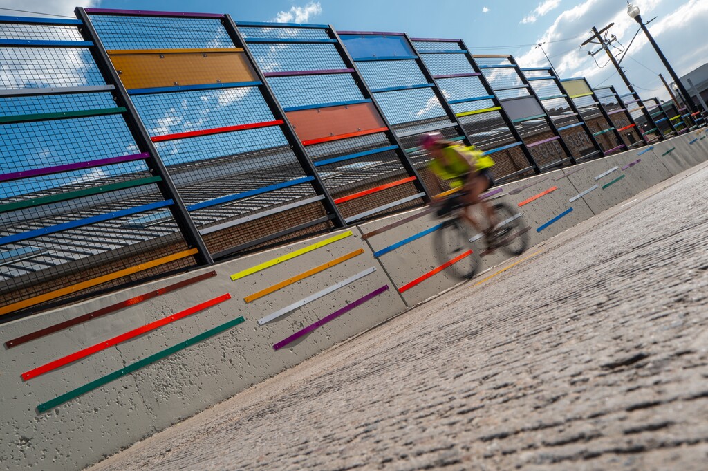(Trent Nelson  |  The Salt Lake Tribune) A cyclist passes Strut, the artwork accompanying the path over the 400 South Viaduct Trail in Salt Lake City on Wednesday, May 27, 2026.
