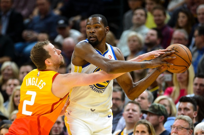 (Steve Griffin  |  The Salt Lake Tribune) Utah Jazz forward Joe Ingles (2) reaches for the ball as Golden State Warriors forward Kevin Durant (35) looks for help during the Utah Jazz versus Golden State Warriors at Vivint Smart Home Arena in Salt Lake City Tuesday January 30, 2018.