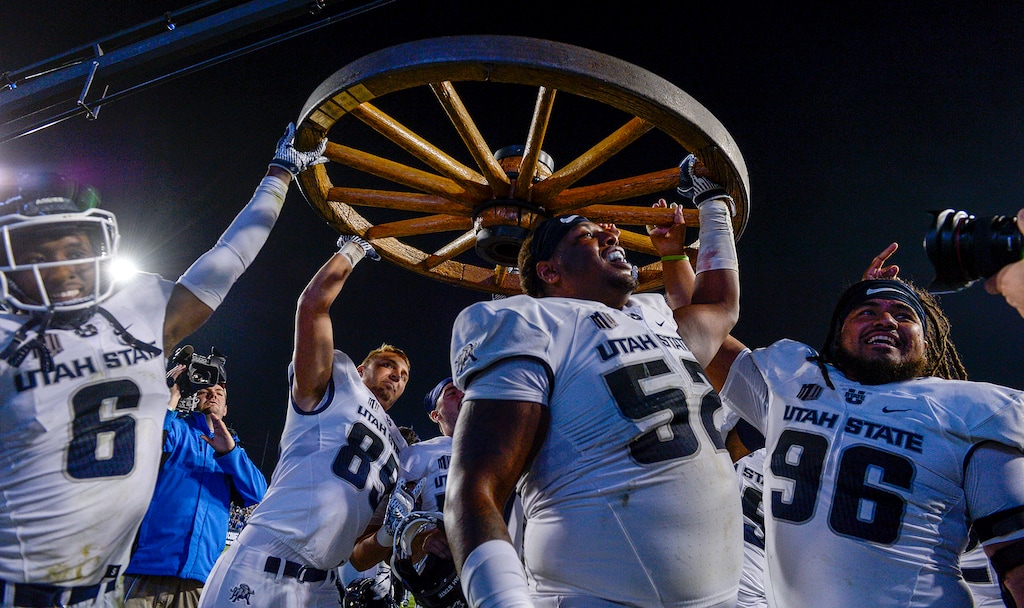 Leah Hogsten  |  The Salt Lake Tribune   Utah State Aggies celebrate the win after defeating BYU, 45-20, at Lavell Edwards Stadium in Provo, Friday, Oct. 5, 2018.