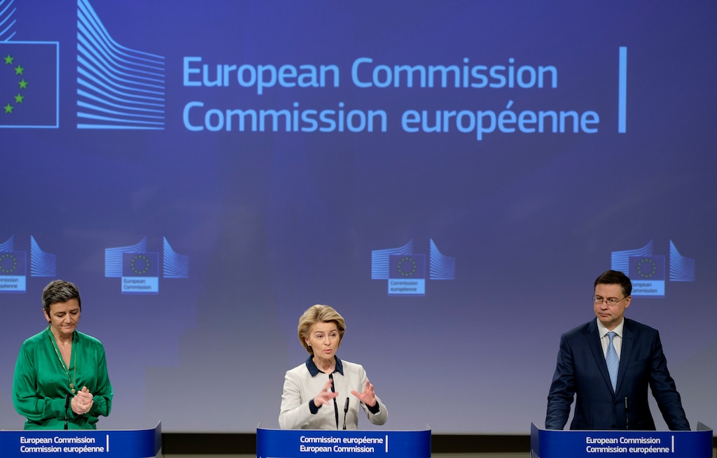 European Commission President Ursula von der Leyen, center, European Commissioner for Europe fit for the Digital Age Margrethe Vestager, left, and European Commissioner for An Economy that Works for People Valdis Dombrovskis, right, participate in a media conference at EU headquarters in Brussels, Friday, March 13, 2020. The European Union on Friday urged member countries to put in place health screening measures at their borders to slow the spread of the novel coronavirus, but warned them to coordinate their actions to ensure that people affected can still quickly get the health care they need. For most people, the new coronavirus causes only mild or moderate symptoms, such as fever and cough. For some, especially older adults and people with existing health problems, it can cause more severe illness, including pneumonia. (AP Photo/Thierry Monasse)