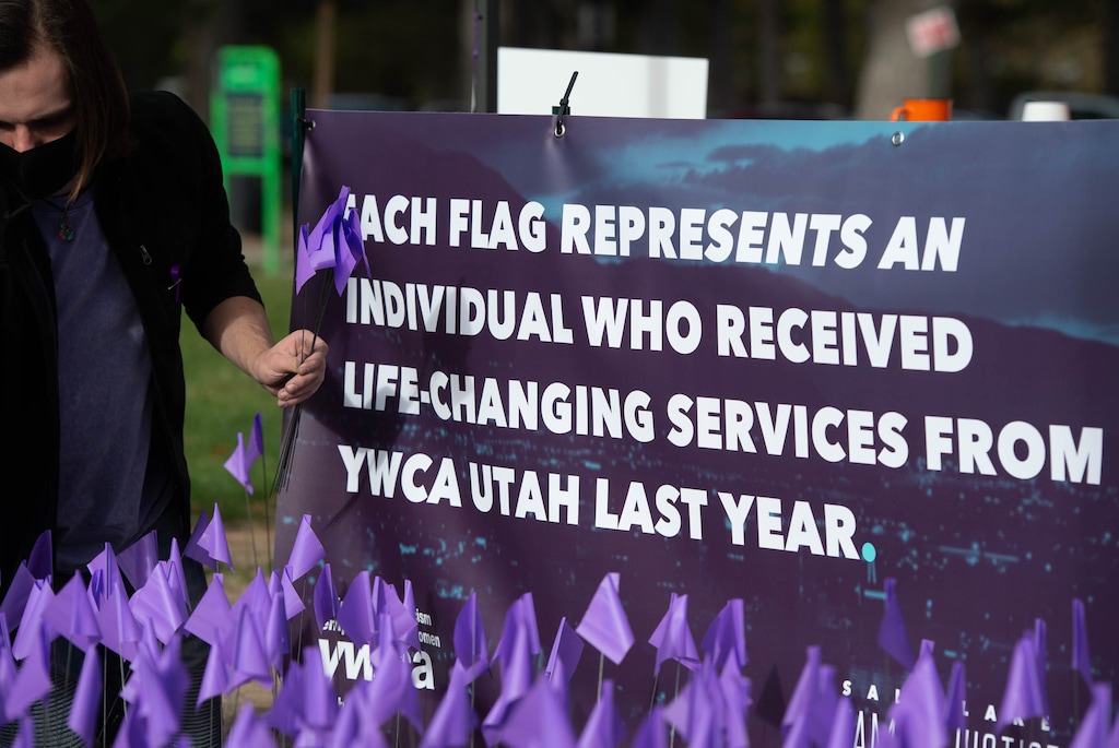 (Francisco Kjolseth | The Salt Lake Tribune) Providers across the state plant flags in public locations in their communities, including Liberty Park in Salt Lake City, on Saturday, Oct. 17, 2020, to recognize the thousands of individuals in Utah who are impacted by domestic violence each year for the Stop the Violence Utah campaign. Funding for that program is threatened by transgender restrictions being considered by lawmakers.