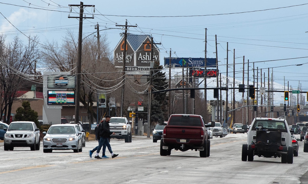 (Francisco Kjolseth  | The Salt Lake Tribune) People cross 300 West in Salt Lake City on Wednesday, Feb. 3, 2021, between 900 South and 2100 South, an area undergoing a major redesign to make it more bike and pedestrian friendly.