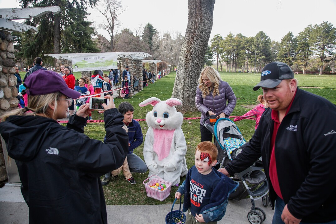 (Nicole Boliaux  |  For The Tribune)  The Phillips family has their photo taken with the Easter Bunny during the annual Easter egg hunt put on by A Kid's Place Dentistry in Liberty Park in Salt Lake City on Saturday, March 31, 2018.