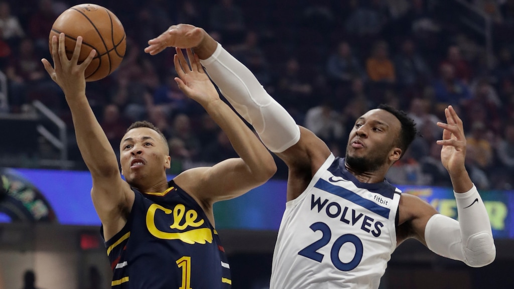 Cleveland Cavaliers' Dante Exum (1) drives to the basket against Minnesota Timberwolves' Josh Okogie (20) in the first half of an NBA basketball game, Sunday, Jan. 5, 2020, in Cleveland. (AP Photo/Tony Dejak)