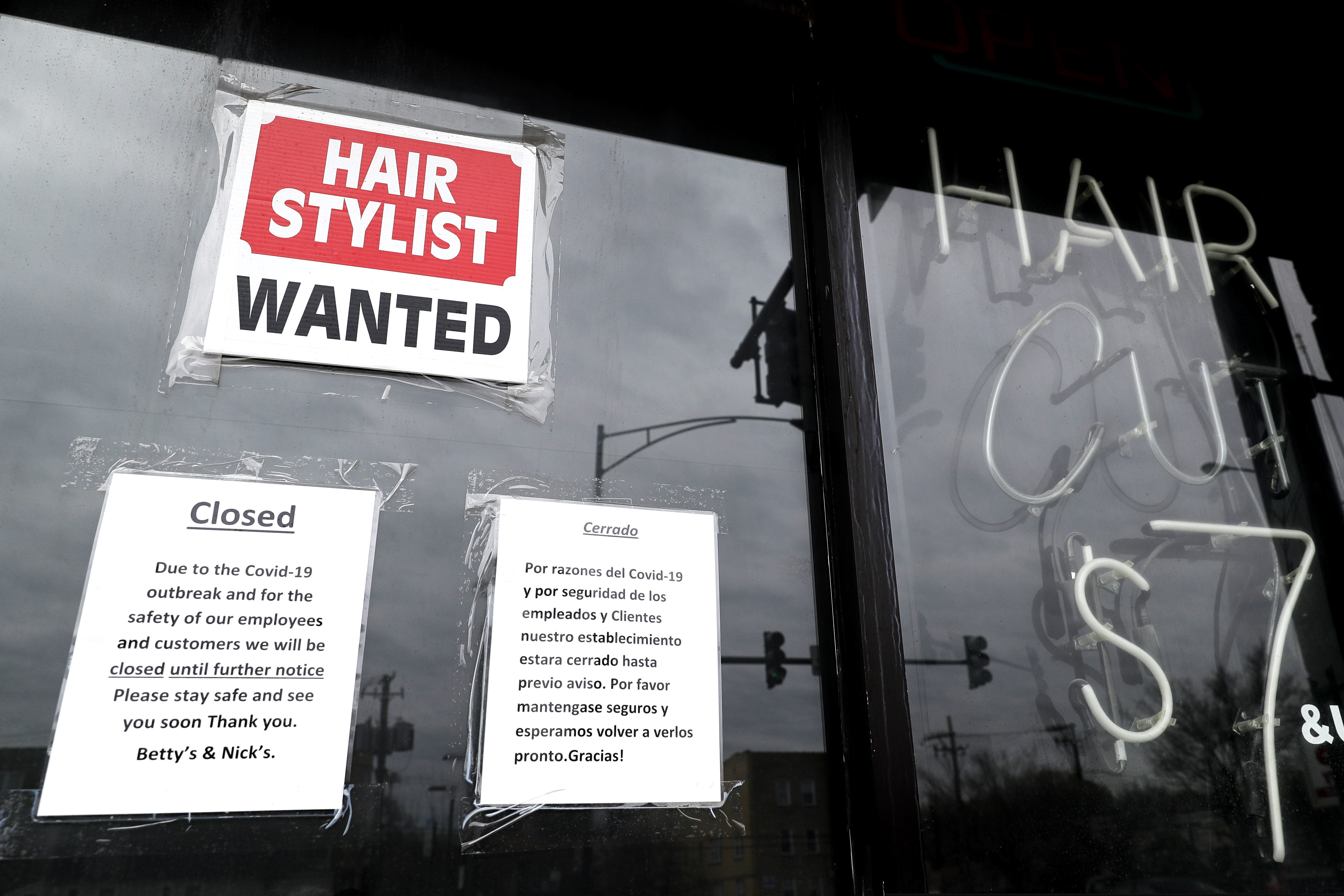 (Nam Y. Huh | AP) In this April 30, 2020 file photo, a barber shop shows closed and hiring sign during the COVID-19 in Chicago. On Thursday, Aug. 27, just over 1 million Americans applied for unemployment benefits last week, a sign that the coronavirus outbreak continues to threaten jobs even as the housing market, auto sales and other segments of the economy rebound from a springtime collapse.