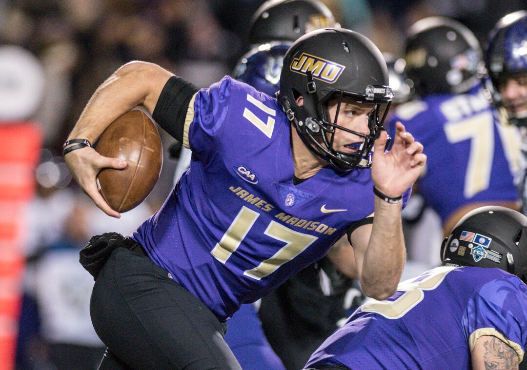 James Madison quarterback Bryan Schor carries the ball against Weber State during the first half of an NCAA college football game in the quarterfinals of the FCS playoffs Friday, Dec. 8, 2017, in Harrisonburg, Va. (Daniel Lin/Daily News-Record via AP)