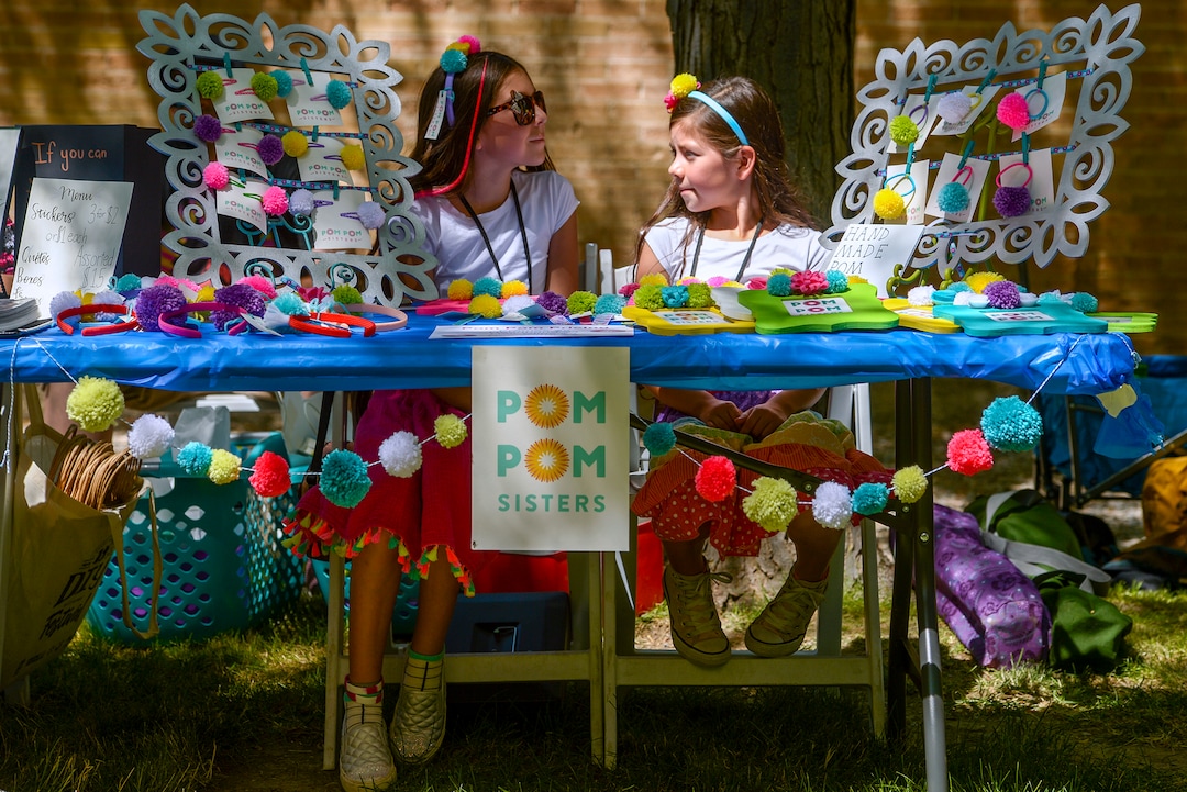(Leah Hogsten  |  The Salt Lake Tribune)  l-r The Pom Pom sisters Evi and Syrri Bateman peddle hair barrettes, headbands, picture frames and ponytail holders decorated with pom poms at the Craft Lake City DIY Festival Kid Row, where children 14 and under make and sell their products. Craft Lake CityÕs DIY Festival is UtahÕs largest local, three day arts festival with over 300 artisans, DIY engineers, vintage vendors and craft food creators.