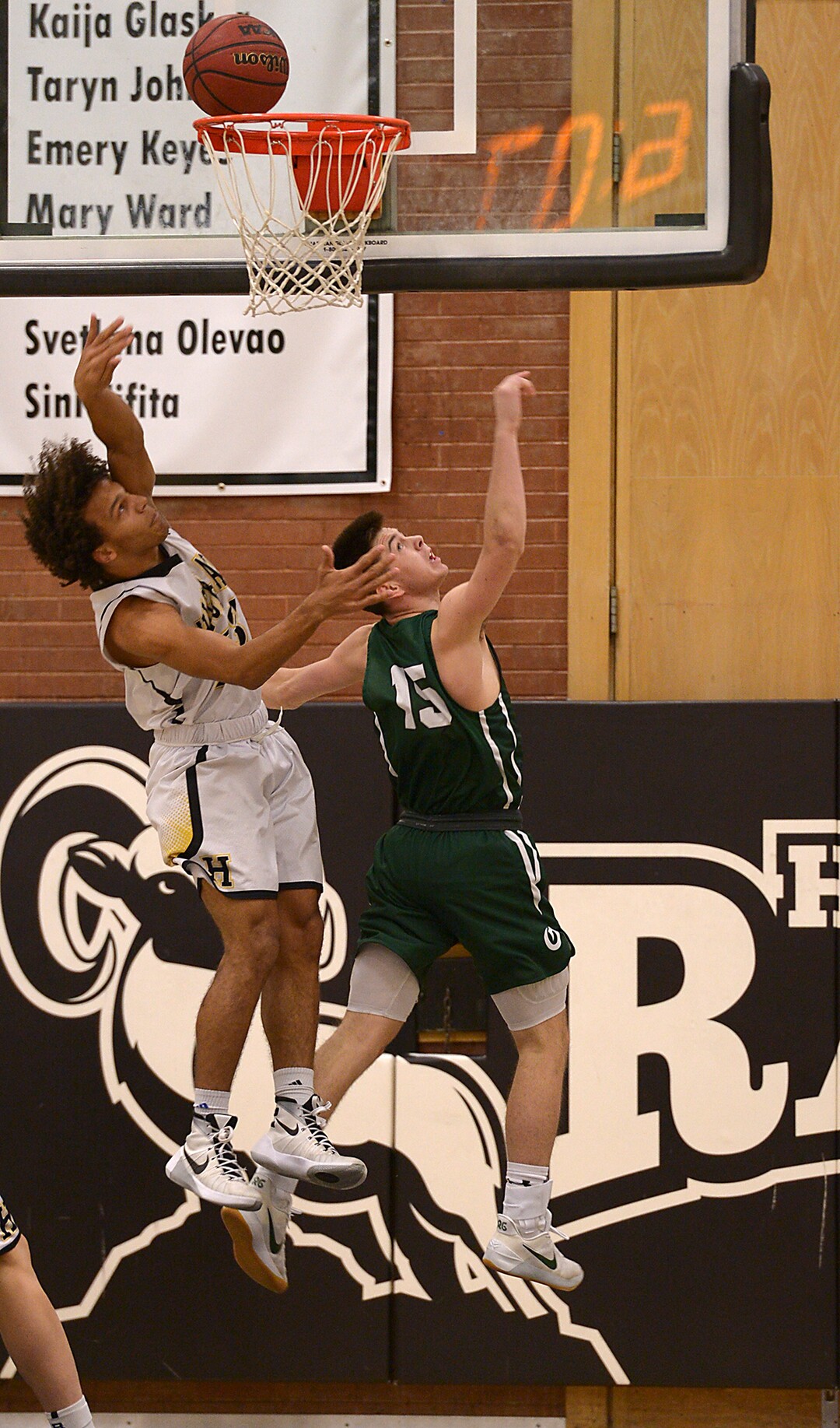 (Leah Hogsten  |  The Salt Lake Tribune) Olympus' Rylan Jones watches his shot sink withHighland's Elijah Shelton. Olympus High School defeated Highland High School 86-54 during their basketball game, Tuesday, February 6, 2018.