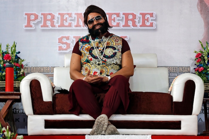 FILE - In this May 17, 2017 file photo, an Indian spiritual guru, who calls himself Saint Dr. Gurmeet Ram Rahim Singh Ji Insan, attends the premiere of the movie 'Jattu Engineer' in New Delhi, India. A north Indian court on Friday, Aug. 25, convicted the flamboyant leader of a quasi-religious sect of raping two of his followers, prompting thousands of supporters camped out near the courthouse to shout angry protests. (AP Photo/Tsering Topgyal, File)